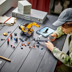 La pelleteuse de chantier jaune